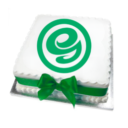 large white celebration cake with the greenhalghs logo and a green ribbon