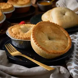 two potato and meat pies next too meat pasties