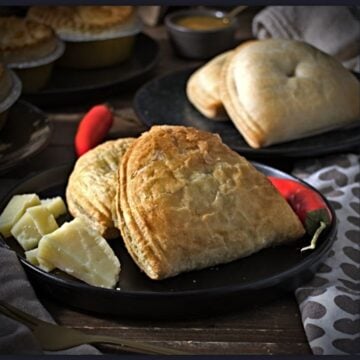 greenhalghs famous cheese and jalapeno pasty surrounded by cheese chunks and red chilies
