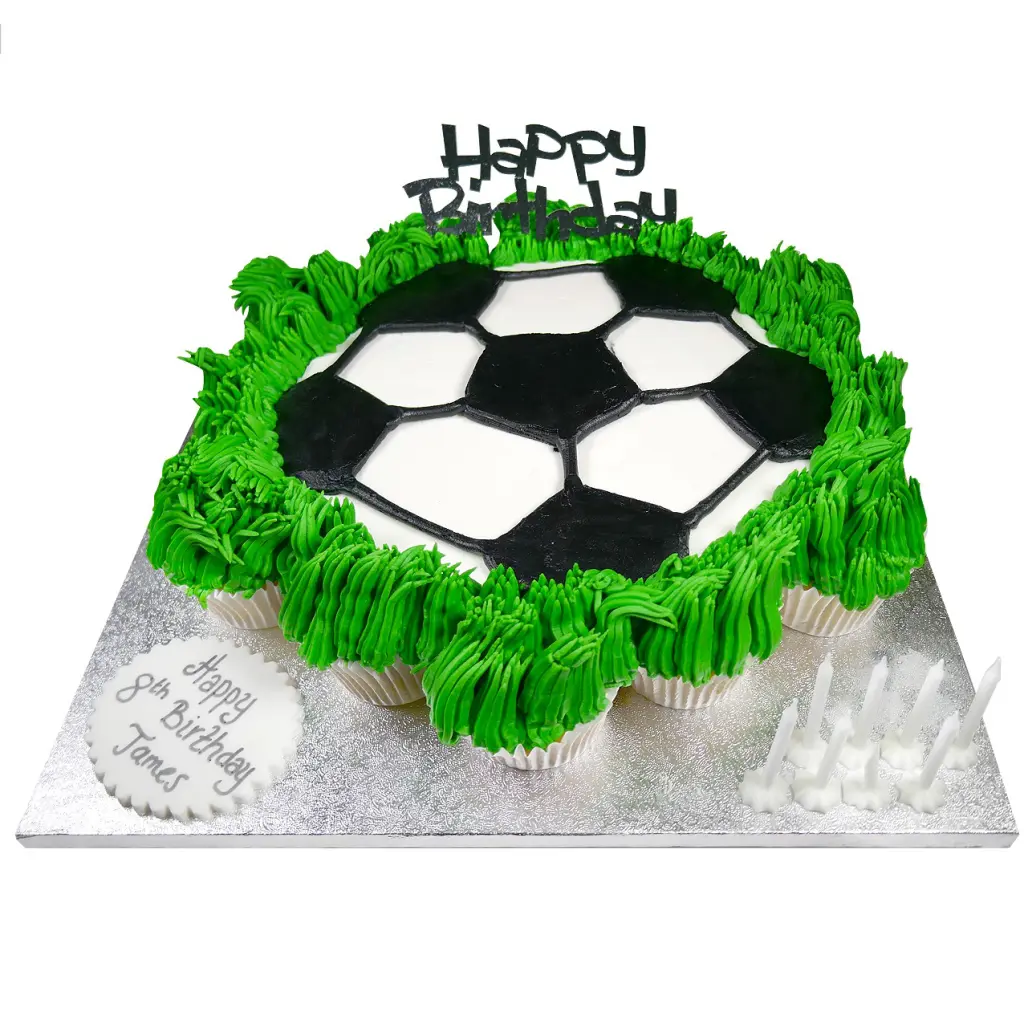 celebration cupcake platter in the shape of a football on grass on a silver board with the inscription happy birthday