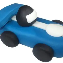 3d blue and white car model made from sugar icing to be used on cakes
