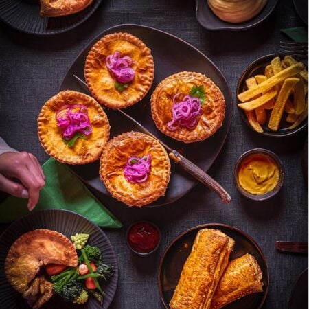 celebration party with sausage rolls, pies and pasties