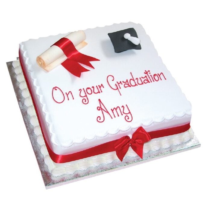 large graduation celebration cake with hat and scroll topping