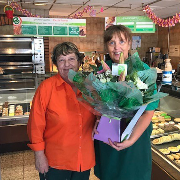 Susan Andrews receiving flowers