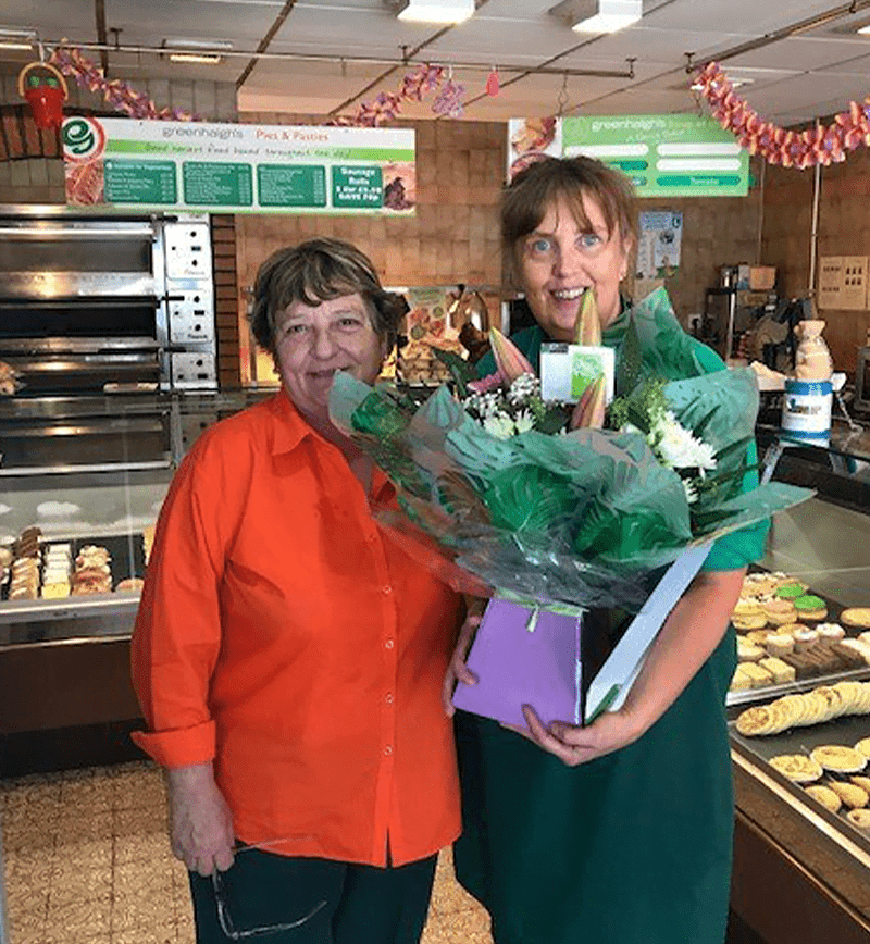 Susan Andrews receiving flowers