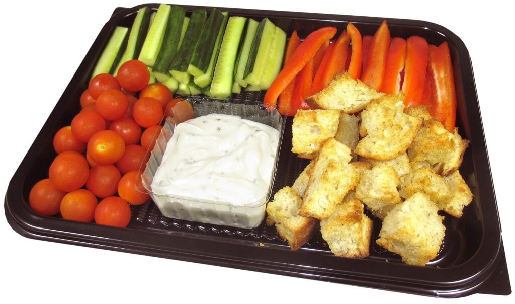 vegetable festive platter with cucumber, peppers, tomatoes and dip