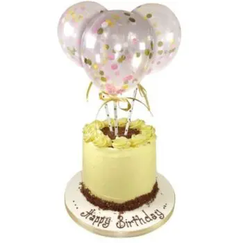single tier celebration cake with three ballons attached