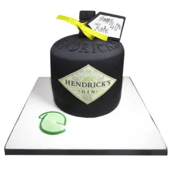 henricks celebration cake in the shape of a black hendricks gin bottle on a white board
