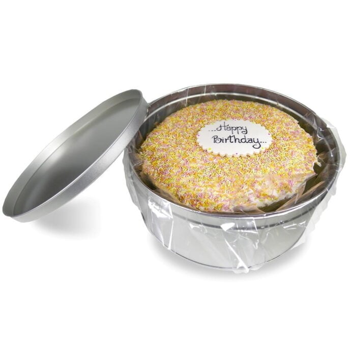 vanilla sprinkles cake in a gift tin