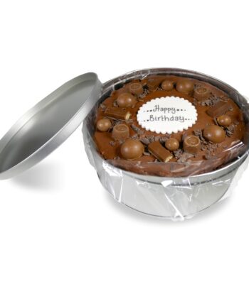 greenhalghs chocolate cake in a silver tin topped with chocolate chunks