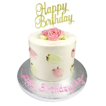 single tier buttercream roses cake topped with a pink flower