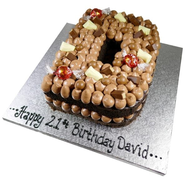 chocolate nut free letter cake layered with chocolate sponge and chocolate chunks on a silver board