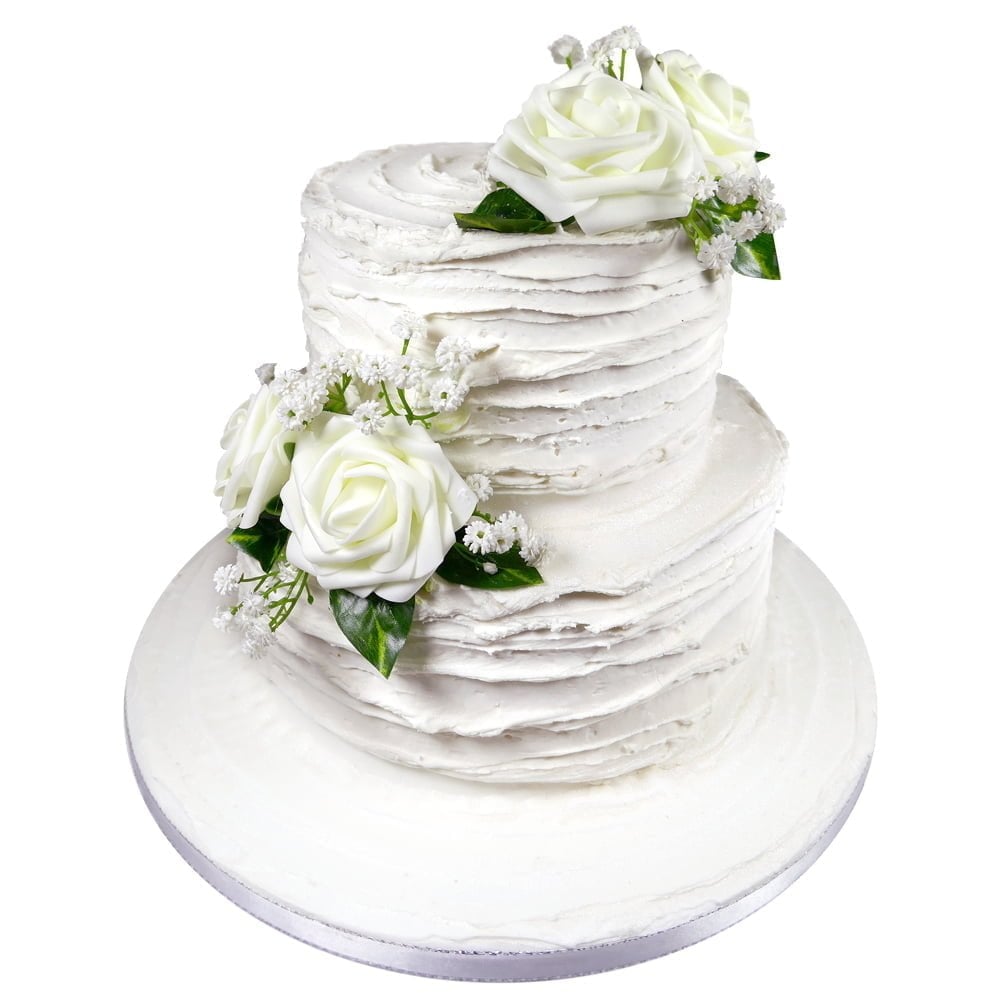 bespoke white two tier wedding cake with white flowers