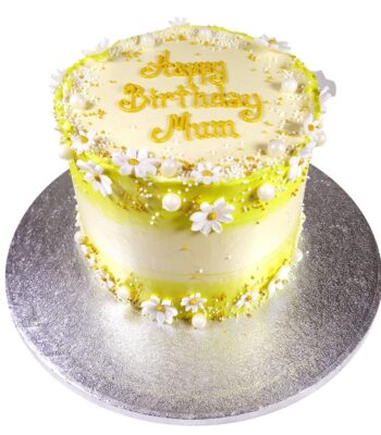 sunshine daisy celebration cake decorated with sugar paste flowers and pearls with the inscription happy birthday