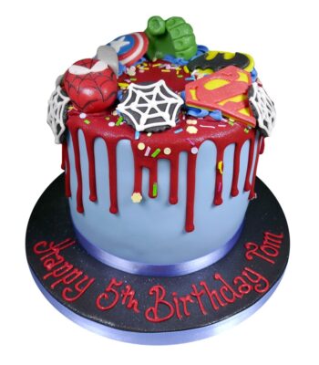 superhero supreme celebration cake with different dc and marvel characters on top of the cake