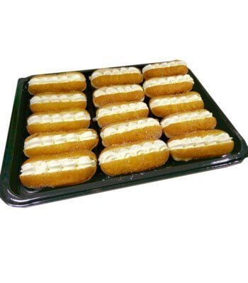 platter of 15 freshly baked mini cream doughnuts on a black serving tray