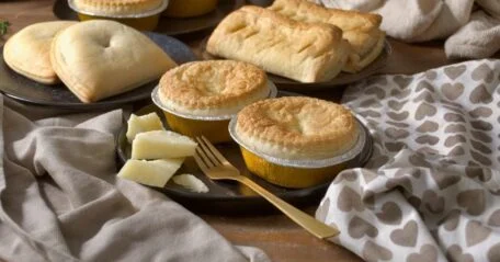 Build your own pie box featuring a selection of freshly baked pies and pasties in assorted flavors, perfect for customized orders.