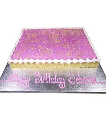 giant pink school cake with a pink inscription