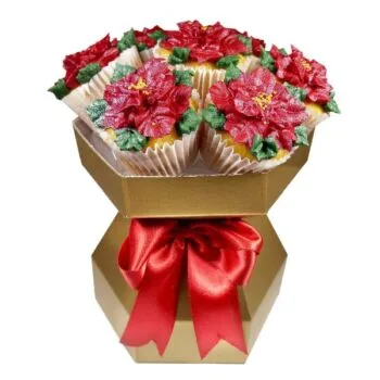 Poinsettia cupcake bouquet with red poinsettia cupcakes in a gold gift box tied with a red bow.