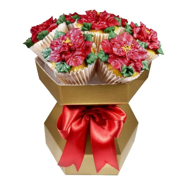 poinsettia-cupcake-bouquet Poinsettia cupcake bouquet with red poinsettia cupcakes in a gold gift box tied with a red bow.